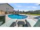 Backyard in-ground pool with lounge chairs at 201 Garden Lily Lane, Summerville, SC 29485