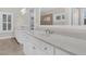 Elegant bathroom featuring dual vanities with white cabinets and quartz countertops, and tile flooring at 2032 Amenity Park Dr, Mount Pleasant, SC 29466