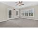 Bright bedroom with carpeting, crown molding, and natural light from windows and access to the outside at 2032 Amenity Park Dr, Mount Pleasant, SC 29466