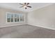 Spacious bedroom featuring plush carpeting, crown molding, and a bright window with plantation shutters at 2032 Amenity Park Dr, Mount Pleasant, SC 29466