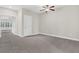 Spacious bedroom with neutral carpeting, ceiling fan, and a view into another bedroom at 2032 Amenity Park Dr, Mount Pleasant, SC 29466
