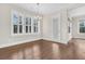 Dining room featuring hardwood flooring, shuttered windows, and a modern chandelier at 2032 Amenity Park Dr, Mount Pleasant, SC 29466