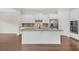 Gourmet kitchen featuring white cabinets, granite countertops, and stainless steel appliances, and large center island at 2032 Amenity Park Dr, Mount Pleasant, SC 29466