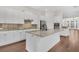 Modern kitchen with white cabinetry, granite countertops, stainless steel appliances, and a center island at 2032 Amenity Park Dr, Mount Pleasant, SC 29466