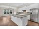 Bright kitchen with granite countertops, a center island, stainless steel appliances and hardwood floors at 2032 Amenity Park Dr, Mount Pleasant, SC 29466