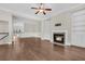 Bright and spacious living room with hardwood floors, a fireplace, and built-in shelving at 2032 Amenity Park Dr, Mount Pleasant, SC 29466