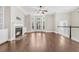 Open living room with hardwood floors, fireplace, built-in shelves, and a window seat at 2032 Amenity Park Dr, Mount Pleasant, SC 29466