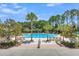 Beautiful pool with lush landscaping, lounge chairs and mature palm trees at 2032 Amenity Park Dr, Mount Pleasant, SC 29466