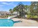 Community waterslide with access by stairs, as well as two lounge chairs for relaxing pool side at 2032 Amenity Park Dr, Mount Pleasant, SC 29466