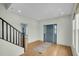 Welcoming foyer features hardwood floors, modern lighting, and an entry door with sidelights at 2097 Mt Pleasant St, Charleston, SC 29403