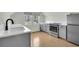 Modern kitchen featuring stainless steel appliances, white countertops, and ample natural light at 2097 Mt Pleasant St, Charleston, SC 29403