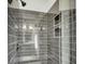 Elegant shower with dark gray tiled walls, built-in niche, and modern fixtures at 2097 Mt Pleasant St, Charleston, SC 29403