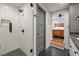 Modern bathroom featuring a glass-enclosed shower with black hardware, and a view into an adjacent bedroom at 2115 Wappoo Dr, Charleston, SC 29412