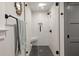 Modern bathroom features a glass-enclosed shower with a built-in seat and black fixtures at 2115 Wappoo Dr, Charleston, SC 29412