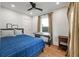 Tranquil bedroom featuring hardwood floors, neutral walls, and a cozy bed with blue patterned bedding at 2115 Wappoo Dr, Charleston, SC 29412
