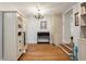 Hallway with hardwood floors, white trim, built in cabinets, and stylish decor at 2115 Wappoo Dr, Charleston, SC 29412