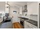 Modern kitchen with granite countertops, stainless steel appliances, and subway tile backsplash at 2115 Wappoo Dr, Charleston, SC 29412