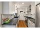 Efficient kitchen featuring stainless steel appliances, granite countertops, and white cabinets at 2115 Wappoo Dr, Charleston, SC 29412