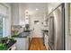 Efficient kitchen featuring stainless steel appliances, granite countertops, and white cabinets at 2115 Wappoo Dr, Charleston, SC 29412