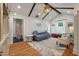 Bright living room with hardwood floors, a vaulted ceiling, comfortable seating, and natural light at 2115 Wappoo Dr, Charleston, SC 29412