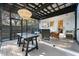 Inviting screened porch with stylish seating, overhead lighting, and view of the backyard at 2115 Wappoo Dr, Charleston, SC 29412