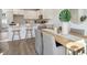 Open concept kitchen with island, dining area, and hardwood floors at 215 Abercom Place Dr, Moncks Corner, SC 29461