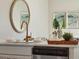Bright kitchen featuring white cabinets, stainless steel dishwasher, modern faucet, and stylish decor at 215 Abercom Place Dr, Moncks Corner, SC 29461