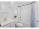 Bright bathroom featuring a shower-tub combo, white vanity and medicine cabinet, complete with fresh towels and a decorative plant at 25 Oak Forest Dr, Charleston, SC 29407