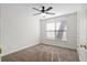 This bedroom features neutral carpet, a ceiling fan with a light fixture and a window bringing in natural light at 25 Oak Forest Dr, Charleston, SC 29407
