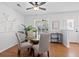 Bright dining room featuring a modern glass table, stylish chairs, and a contemporary ceiling fan at 25 Oak Forest Dr, Charleston, SC 29407
