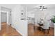 Bright dining area boasts an open layout with stylish table, ceiling fan, and wood-look flooring at 25 Oak Forest Dr, Charleston, SC 29407