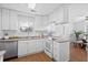 Well-lit kitchen features white cabinets, laminate countertops, and stainless steel appliances at 25 Oak Forest Dr, Charleston, SC 29407