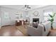 Well-lit living room boasting a cozy fireplace, elegant decor, and hardwood floors, creating a warm atmosphere at 25 Oak Forest Dr, Charleston, SC 29407
