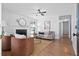 Bright living room featuring a cozy fireplace, stylish decor, and hardwood floors at 25 Oak Forest Dr, Charleston, SC 29407
