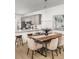 Modern dining area featuring a wooden table with upholstered chairs and a pendant light fixture at 209 Abercom Place Dr, Moncks Corner, SC 29461