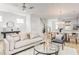 Spacious living room open to dining area and kitchen offering a comfortable seating arrangement at 209 Abercom Place Dr, Moncks Corner, SC 29461