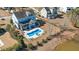 Private backyard with a custom pool, hot tub, and screened-in porch overlooking a lake at 3003 Yachtsman Dr, Mount Pleasant, SC 29466