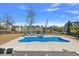 Expansive backyard with a pool, spa, lounge chairs, and well-maintained landscaping at 3003 Yachtsman Dr, Mount Pleasant, SC 29466
