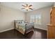 This bedroom features hardwood floors, a ceiling fan, and large windows at 3003 Yachtsman Dr, Mount Pleasant, SC 29466