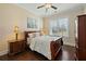 Cozy bedroom with hardwood floors, a plush bed, and ample natural light from the window, creating a tranquil retreat at 3003 Yachtsman Dr, Mount Pleasant, SC 29466