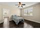 Bright bedroom featuring hardwood floors, ceiling fan, and a large window allowing plenty of natural light at 3003 Yachtsman Dr, Mount Pleasant, SC 29466