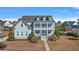 Charming two-story Lowcountry home with a welcoming front porch and double balconies at 3003 Yachtsman Dr, Mount Pleasant, SC 29466