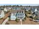 Inviting two-story home with a charming double porch and a well-maintained lawn at 3003 Yachtsman Dr, Mount Pleasant, SC 29466