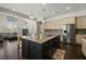 Open-concept kitchen with stainless steel appliances and granite counters adjacent to living space at 3003 Yachtsman Dr, Mount Pleasant, SC 29466