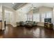 Open living room with vaulted ceiling, large windows, and hardwood floors, creating an inviting and airy space at 3003 Yachtsman Dr, Mount Pleasant, SC 29466