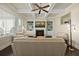 Comfortable living room with coffered ceilings, a fireplace, built-in shelves, and hardwood floors for cozy relaxation at 3003 Yachtsman Dr, Mount Pleasant, SC 29466