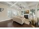 Bright living room featuring coffered ceilings, a fireplace, built-in shelves, and hardwood floors for comfortable living at 3003 Yachtsman Dr, Mount Pleasant, SC 29466