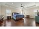 Spacious main bedroom featuring a tray ceiling, hardwood floors, and abundant natural light at 3003 Yachtsman Dr, Mount Pleasant, SC 29466