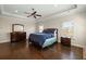 Relaxing main bedroom boasting hardwood floors, tray ceilings, and ample natural light at 3003 Yachtsman Dr, Mount Pleasant, SC 29466