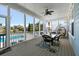 Inviting screened porch featuring comfortable seating, overhead lighting, and views of the pool at 3003 Yachtsman Dr, Mount Pleasant, SC 29466